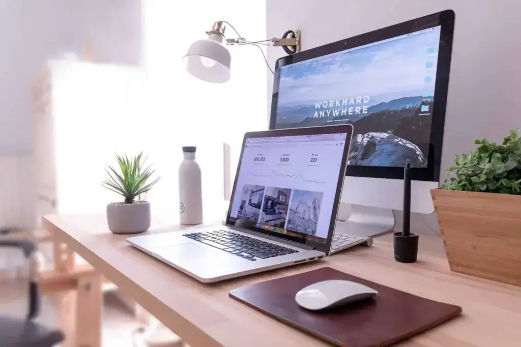 Desktop and laptop web design workstation at Launch Digital